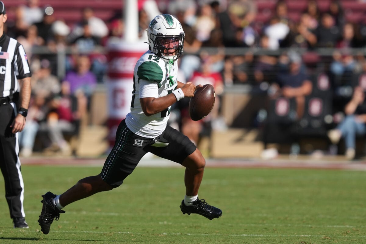 Aug 29, 2026; Stanford, California, USA; Hawaii Rainbow Warriors quarterback Micah Alejado (12) scrambles against the Stanford Cardinal during the second quarter at Stanford Stadium. Mandatory Credit: Darren Yamashita-Imagn Images