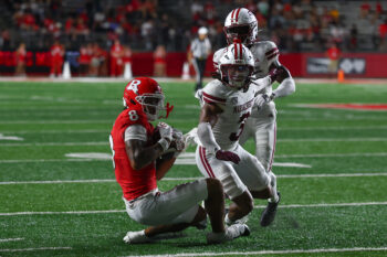 Sep 3, 2026; Piscataway, New Jersey, USA; Rutgers Scarlet Knights wide receiver KJ Duff (8) makes a catch as Massachusetts Minutemen safety Kendall Bournes (3) defends at SHI Stadium. Mandatory Credit: Vincent Carchietta-Imagn Images