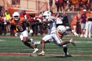 Sep 5, 2026; Austin, Texas, USA;  Texas State Bobcats   wide receiver Chris Dawn, Jr. (1) escapes a tackle attempt by Texas Longhorns defensive back Jonah Williams (9) during the second quarter at Darrell K Royal-Texas Memorial Stadium.  Mandatory Credit: Scott Wachter-Imagn Images