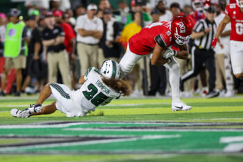 Sep 5, 2026; Honolulu, Hawaii, USA;  Hawaii Rainbow Warriors defensive back Matagi Thompson (25) pulls down UNLV Rebels tight end Keyan Burnett (84) during the fourth quarter at the Clarence T.C. Ching Athletics Complex.  Mandatory Credit: Marco Garcia-Imagn Images