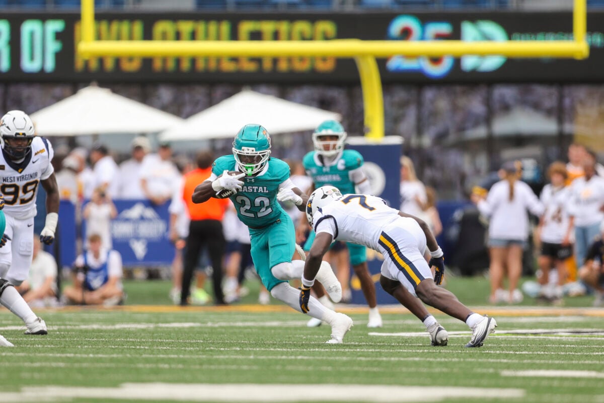 Sep 5, 2026; Morgantown, West Virginia, USA; Coastal Carolina Chanticleers running back Breyahn Townsend (22) runs the ball during the third quarter against the West Virginia Mountaineers at Milan Puskar Stadium. Mandatory Credit: Ben Queen-Imagn Images