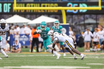 Sep 5, 2026; Morgantown, West Virginia, USA; Coastal Carolina Chanticleers running back Breyahn Townsend (22) runs the ball during the third quarter against the West Virginia Mountaineers at Milan Puskar Stadium. Mandatory Credit: Ben Queen-Imagn Images