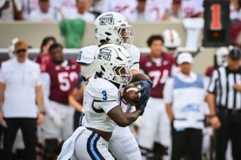 Sep 12, 2026; Blacksburg, Virginia, USA;  Old Dominion Monarchs quarterback Quinn Henicle (10) hands the ball off to running back Devin Roche (3) during the first quarter at Lane Stadium.  Mandatory Credit: Brian Bishop-Imagn Images