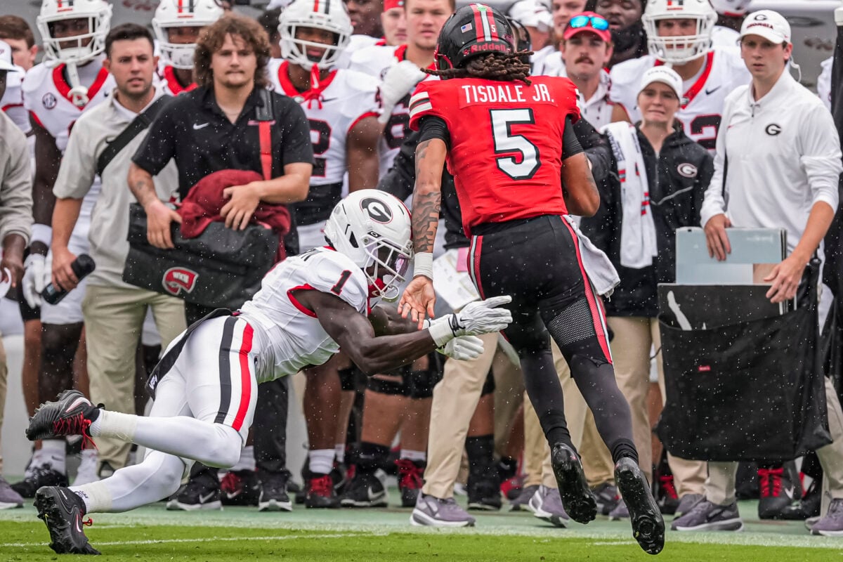 Sep 12, 2026; Athens, Georgia, USA; Georgia Bulldogs defensive back Ellis Robinson IV (1) tackles Western Kentucky Hilltoppers quarterback Rodney Tisdale Jr. (5) at Sanford Stadium. Mandatory Credit: Dale Zanine-Imagn Images