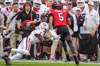 Sep 12, 2026; Athens, Georgia, USA; Georgia Bulldogs defensive back Ellis Robinson IV (1) tackles Western Kentucky Hilltoppers quarterback Rodney Tisdale Jr. (5) at Sanford Stadium. Mandatory Credit: Dale Zanine-Imagn Images