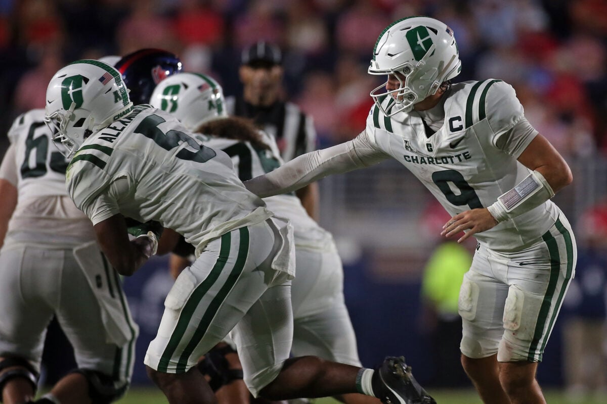 Sep 12, 2026; Oxford, Mississippi, USA; Charlotte 49ers quarterback Cole Gonzales (9) hands the ball off to running back Khamani Alexander (5) during the third quarter against the Mississippi Rebels at Vaught-Hemingway Stadium. Mandatory Credit: Petre Thomas-Imagn Images
