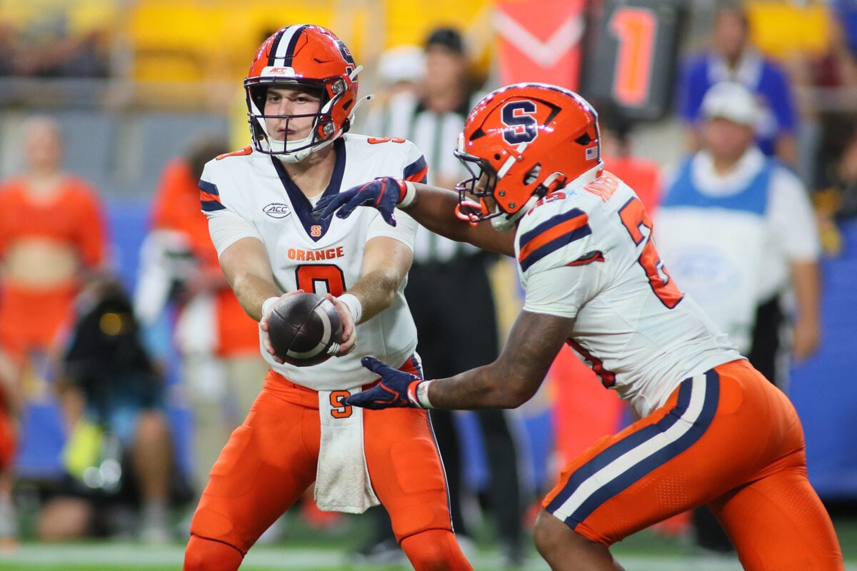 Syracuse Orange quarterback Steve Angeli (9) hands the ball off to running back Shavane Anderson Jr. (23) during the first half against the Pittsburgh Panthers at Acrisure Stadium in Pittsburgh, PA on September 17, 2026.