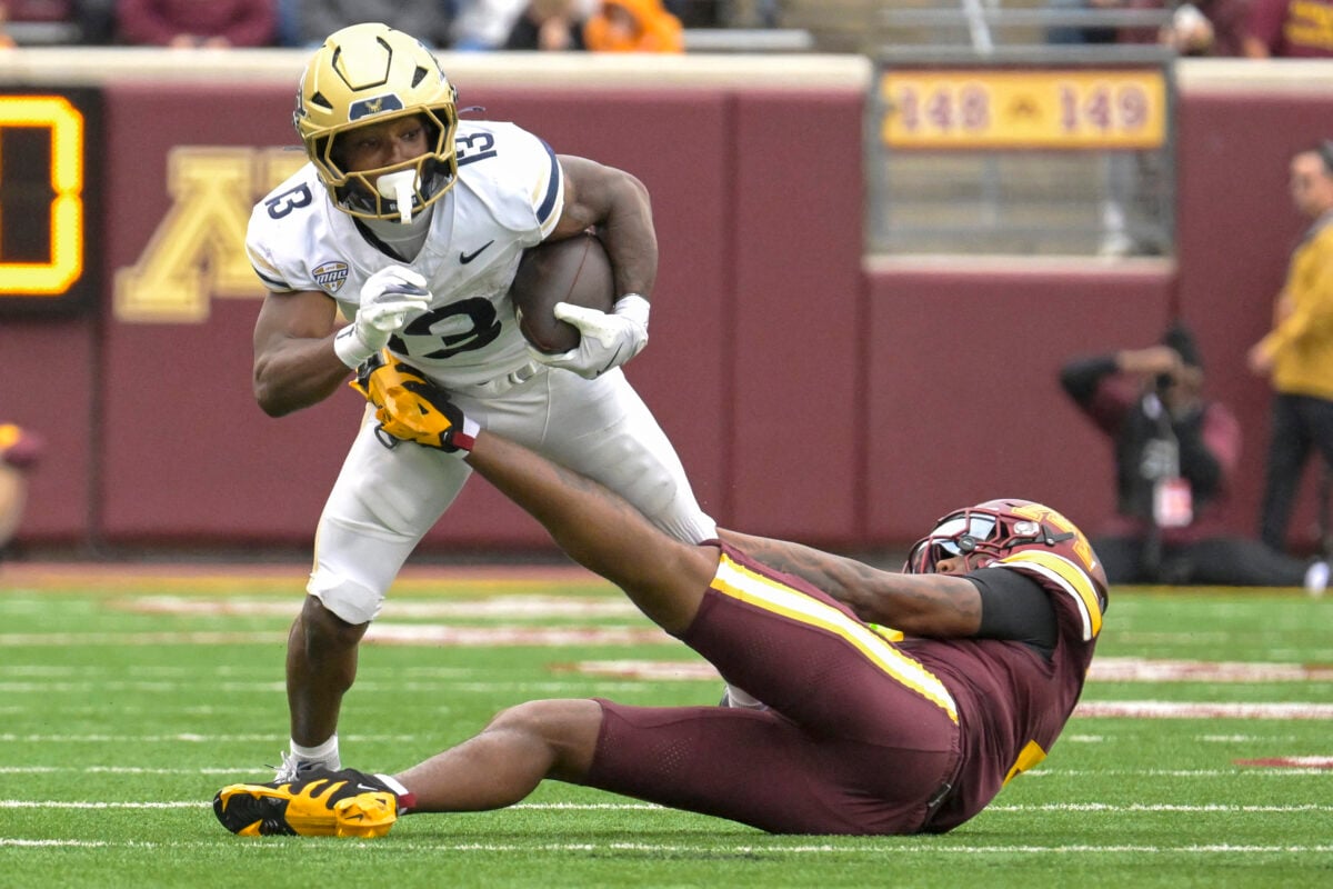 Sep 19, 2026; Minneapolis, Minnesota, USA; Minnesota Golden Gophers deffensive back Zack Harden (4) ties up Akron Zips running back Sean Patrick (13) during the first half at Huntington Bank Stadium. Mandatory Credit: Nick Wosika-Imagn Images