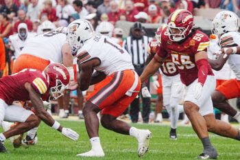Iowa State defensive end Jace Gilbert (55) and cornerback Seth Johnson (3) bring down Bowling Green running back Austyn Dendy (1) during the first quarter on Sept. 19, 2026, at Jack Trice Stadium in Ames, Iowa.