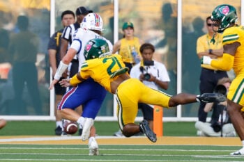 Sep 19, 2026; Waco, Texas, USA;  Louisiana Tech Bulldogs quarterback Trey Kukuk (2) fumbles the ball as he is tackled by Baylor Bears safety Bo Onu (21) during the second half at McLane Stadium.  Mandatory Credit: Chris Jones-Imagn Images