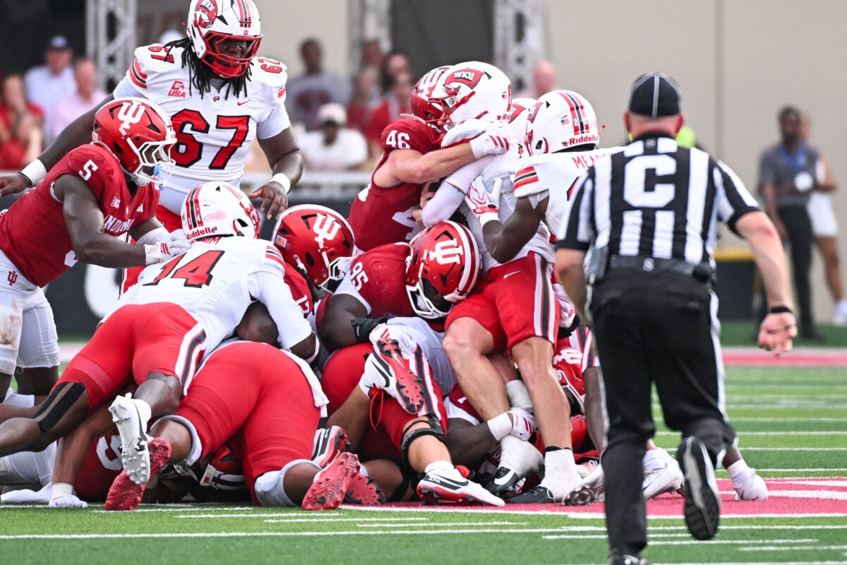 Sep 19, 2026; Bloomington, Indiana, USA; Indiana Hoosiers linebacker Isaiah Jones (46) stops Western Kentucky Hilltoppers quarterback Brock Glenn (11) on fourth down during the second half at Merchants Bank Field at Memorial Stadium. Mandatory Credit: Robert Goddin-Imagn Images