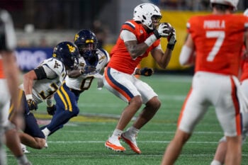 Sep 19, 2026; Charlotte, North Carolina, USA;  Virginia Cavaliers tight end Dakota Twitty (9) catches a pass from quarterback Beau Pribula (7) and pursued by West Virginia Mountaineers safety Andrew Powdrell (0)during the second half against the West Virginia Mountaineers at Bank of America Stadium.  Mandatory Credit: Jim Dedmon-Imagn Images
