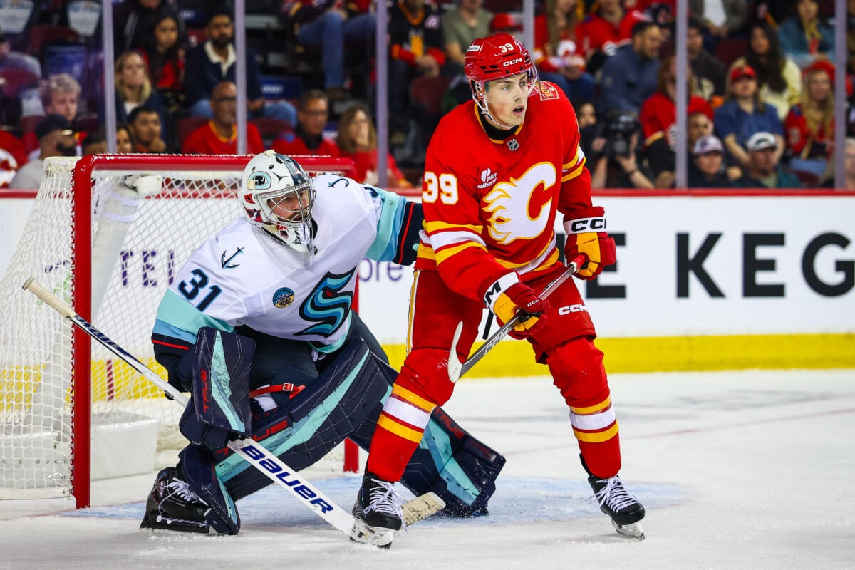 Sep 20, 2026; Calgary, Alberta, CAN; Calgary Flames center Tyson Gross (39) screens in front of Seattle Kraken goaltender Philipp Grubauer (31) during the second period at Scotiabank Saddledome. Mandatory Credit: Sergei Belski-Imagn Images