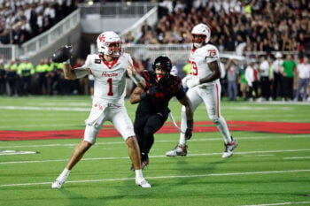 Sep 18, 2026; Lubbock, Texas, USA;  Houston Cougars quarterback Conner Weigman (1) is pressured by Texas Tech Red Raiders defensive end Trey White (2) in the second half at Galaxy Stadium. Mandatory Credit: Michael C. Johnson-Imagn Images