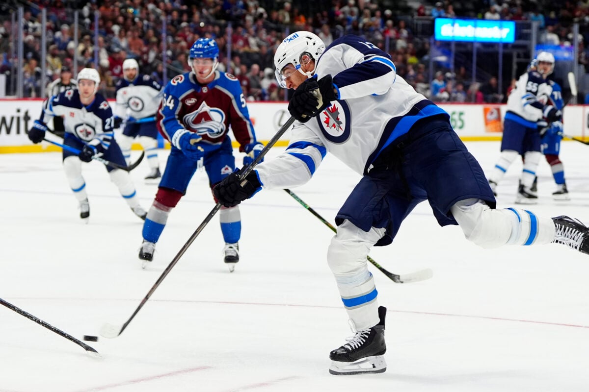 Sep 25, 2026; Denver, Colorado, USA; Winnipeg Jets center Gabriel Vilardi (13) shoots the puck in the first period against the Colorado Avalanche at Ball Arena. Mandatory Credit: Ron Chenoy-Imagn Images