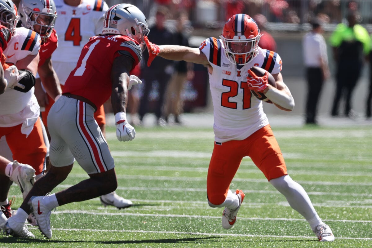 Sep 26, 2026; Columbus, Ohio, USA;  Illinois Fighting Illini running back Aidan Laughery (21) fights for yards as Ohio State Buckeyes safety Earl Little Jr. (1) pursues at Ohio Stadium.  Mandatory Credit: Joseph Maiorana-Imagn Images