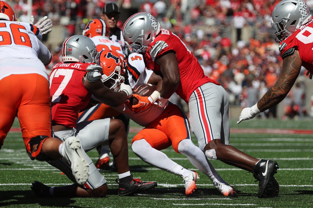 Sep 26, 2026; Columbus, Ohio, USA; Illinois Fighting Illini running back Ca'Lil Valentine (5) is tackled by Ohio State Buckeyes linebacker Tarvos Alford (17) during the second half at Ohio Stadium. Mandatory Credit: Joseph Maiorana-Imagn Images