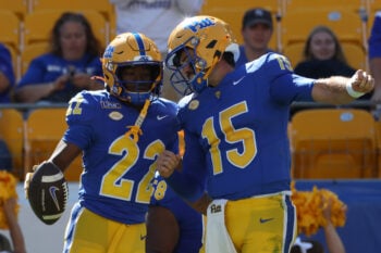 Sep 26, 2026; Pittsburgh, Pennsylvania, USA;  Pittsburgh Panthers wide receiver Bryan Hamilton (22) and quarterback Holden Geriner (15) celebrate after combining for a touchdown completion against the Bucknell Bison during the fourth quarter at Acrisure Stadium.  Mandatory Credit: Charles LeClaire-Imagn Images