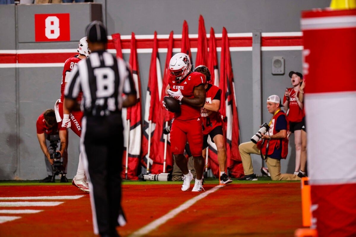 Sep 26, 2026; Raleigh, North Carolina, USA;  NC State Wolfpack running back Jayden Scott (1) celebrates a touchdown during the first half of the game against App State Mountaineers at Carter-Finley Stadium.  Mandatory Credit: Jaylynn Nash-Imagn Images