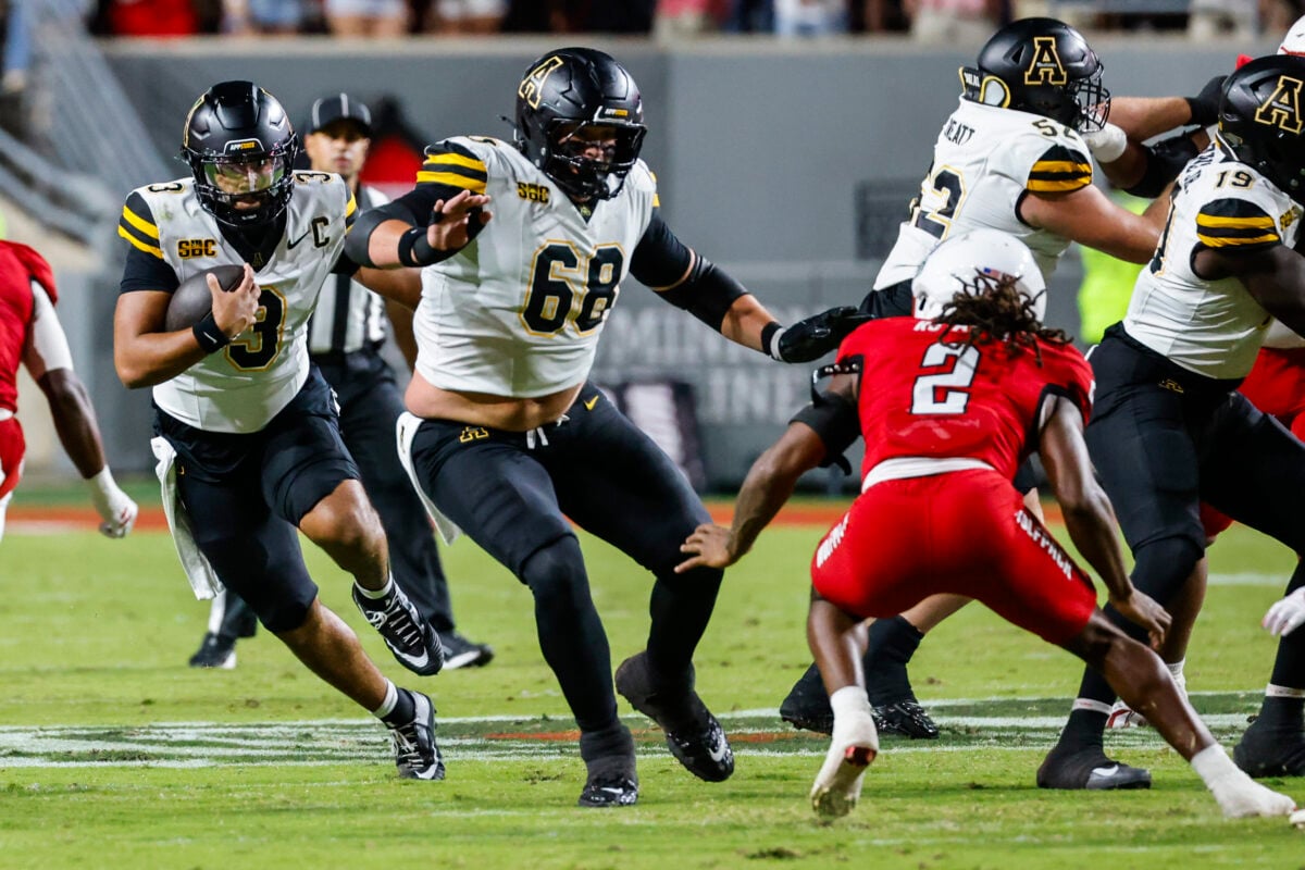 Sep 26, 2026; Raleigh, North Carolina, USA;  App State Mountaineers quarterback Malachi Singleton (3) runs with the football during the first half of the game against NC State Wolfpack at Carter-Finley Stadium.  Mandatory Credit: Jaylynn Nash-Imagn Images