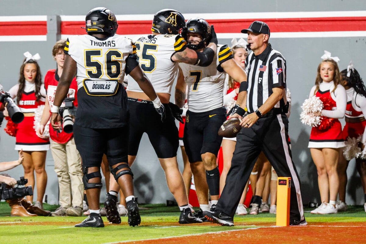 Sep 26, 2026; Raleigh, North Carolina, USA; App State Mountaineers tight end Darrin Fugitt (7) celebrates a touchdown with offensive lineman Jayden Thomas (56) and linebacker Brooks Yurachek (35) during the first half of the game against NC State Wolfpack at Carter-Finley Stadium. Mandatory Credit: Jaylynn Nash-Imagn Images