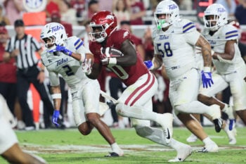 Sep 26, 2026; Fayetteville, Arkansas, USA;  Arkansas Razorbacks running back Braylen Russell (0) rushes during the fourth quarter against the Tulsa Golden Hurricanes at Donald W. Reynolds Razorback Stadium.  Mandatory Credit: Nelson Chenault-Imagn Images