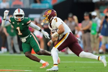 Sep 26, 2026; Miami Gardens, Florida, USA; Central Michigan Chippewas quarterback Angel Flores (7) runs with the football against the Miami Hurricanes during the first quarter at Hard Rock Stadium. Mandatory Credit: Sam Navarro-Imagn Images