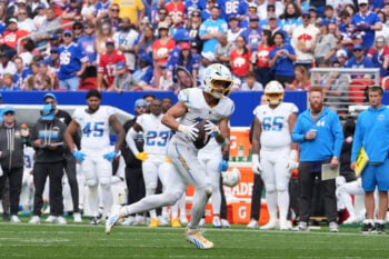 Sep 27, 2026; Orchard Park, New York, USA;  Los Angeles Chargers wide receiver Ladd McConkey (15) runs with the ball in the second half against the Buffalo Bills at New Highmark Stadium.  Mandatory Credit: Gregory Fisher-Imagn Images
