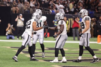 Sep 27, 2026; New Orleans, Louisiana, USA;  Las Vegas Raiders wide receiver Cody White (82) celebrates a touchdown with running back Ashton Jeanty (2) in the fourth quarter against the New Orleans Saints at Caesars Superdome.  Mandatory Credit: Stephen Lew-Imagn Images