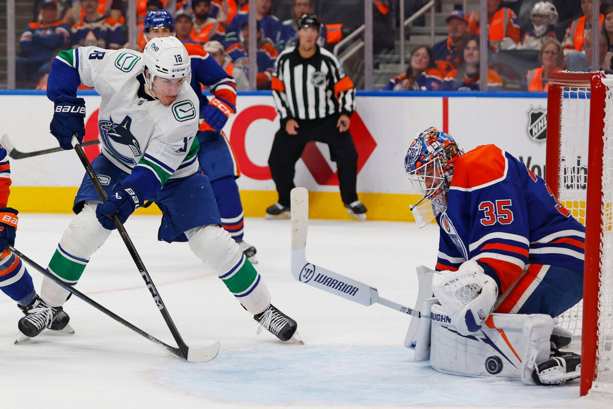 Sep 29, 2026; Edmonton, Alberta, CAN;  Edmonton Oilers goaltender Tristan Jarry (35) makes a save against Vancouver Canucks forward Drew O'Connor (18) during the second period at Rogers Place.  Mandatory Credit: Perry Nelson-Imagn Images