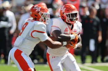 Sep 26, 2026; Lubbock, Texas, USA;  Sam Houston Bearkat quarterback Brett Holloway (9) hands the ball to running back Alton McCaskill (22) in the first half against the Texas Tech Red Raiders at Galaxy Stadium. Mandatory Credit: Michael C. Johnson-Imagn Images