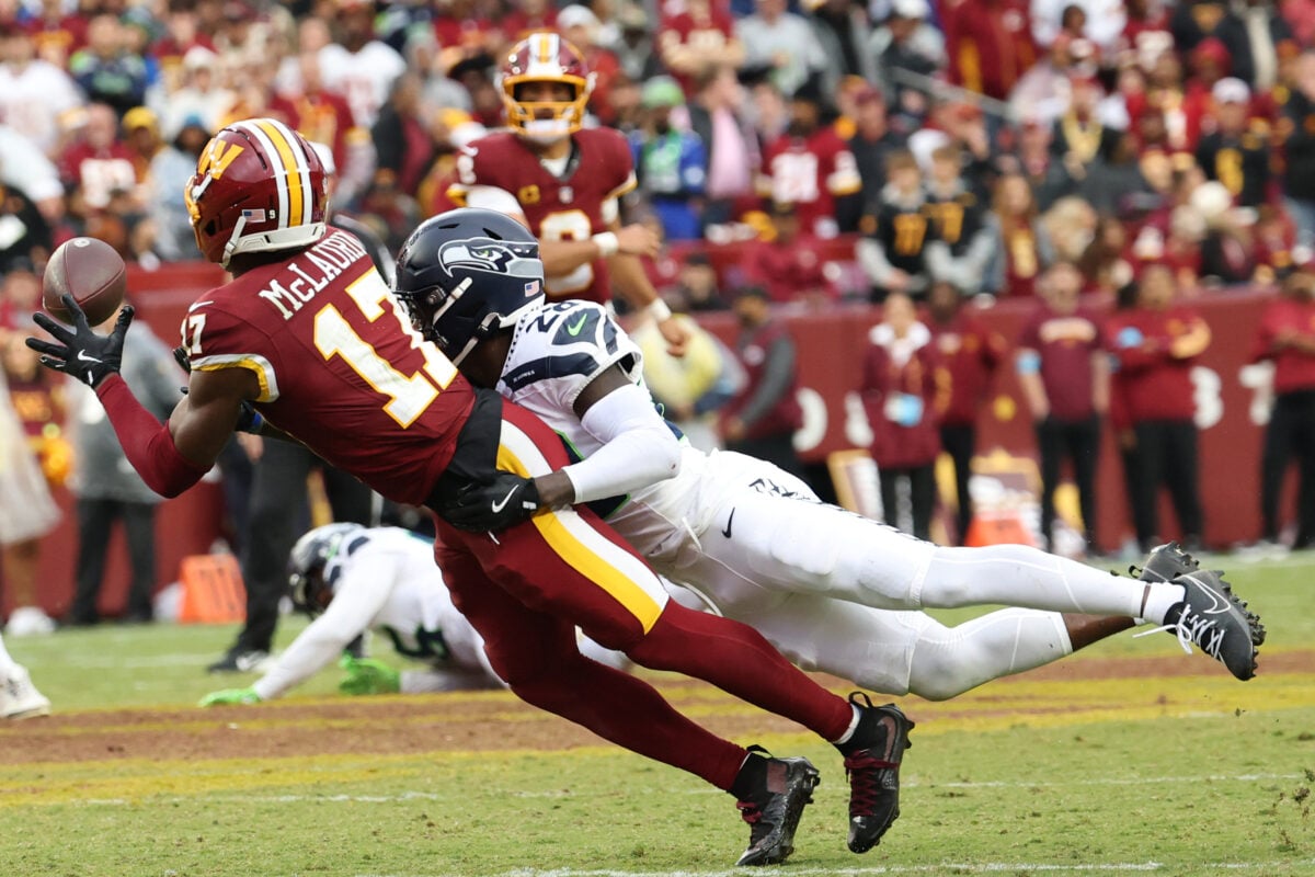Sep 27, 2026; Landover, Maryland, USA; Washington Commanders wide receiver Terry McLaurin (17) dives to make a catch as Seattle Seahawks cornerback Nehemiah Pritchett (28) defends at Northwest Stadium. Mandatory Credit: Geoff Burke-Imagn Images