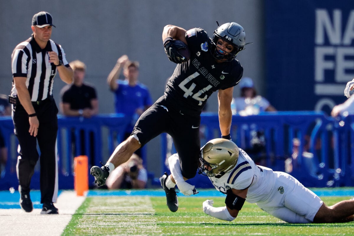 Oct 3, 2026; Colorado Springs, Colorado, USA; Air Force Falcons running back Rocco Conti (44) runs the ball against Navy Midshipmen safety Giuseppe Sessi (16) in the second quarter at Falcon Stadium. Mandatory Credit: Isaiah J. Downing-Imagn Images