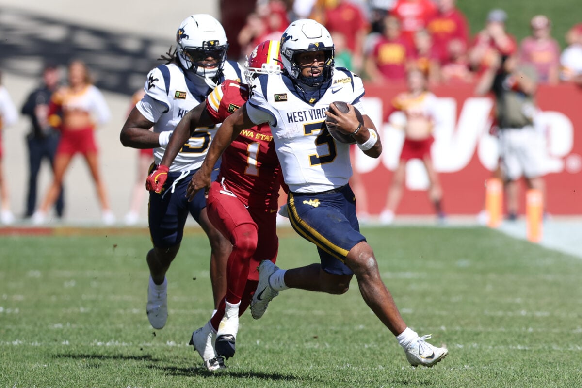 Oct 3, 2026; Ames, Iowa, USA;  Iowa State Cyclones cornerback Keyon Washington (1) chases West Virginia Mountaineers quarterback Michael Hawkins Jr. (3) at Jack Trice Stadium.  Mandatory Credit: Reese Strickland-Imagn Images