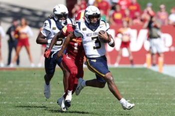 Oct 3, 2026; Ames, Iowa, USA;  Iowa State Cyclones cornerback Keyon Washington (1) chases West Virginia Mountaineers quarterback Michael Hawkins Jr. (3) at Jack Trice Stadium.  Mandatory Credit: Reese Strickland-Imagn Images