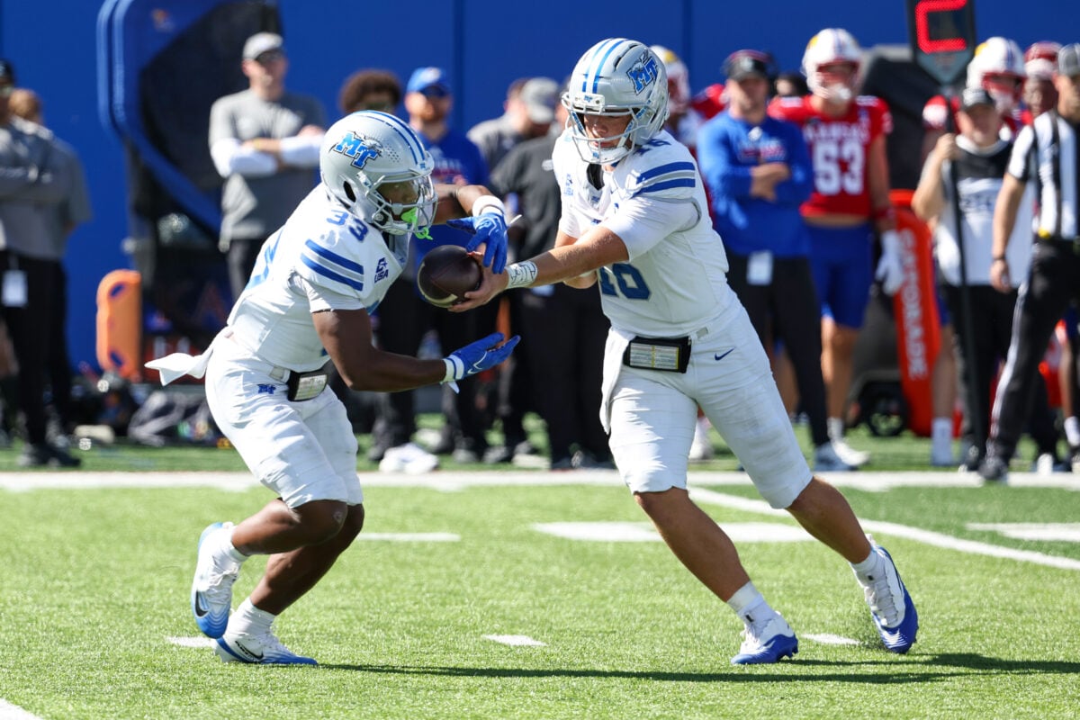 Oct 3, 2026; Lawrence, Kansas, USA; Middle Tennessee Blue Raiders quarterback Roman Gagliano (16) hands off to running back Brooklen Davis (33) during the fourth quarter against the Kansas Jayhawks at David Booth Kansas Memorial Stadium. Mandatory Credit: Scott Sewell-Imagn Images