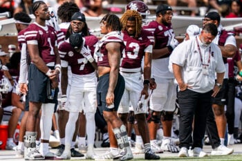 Mississippi State quarterback Kamario Taylor (1) talks with wide receiver Zion Ragins (7) and running back Fluff Bothwell (24) on the sideline during a college football game between Mississippi State and Alabama at Davis Wade Stadium in Starkville, Miss., on Saturday, Oct. 3, 2026. Alabama defeated Mississippi State 56-23. Taylor and Bothwell were both taken out of the game for injuries.