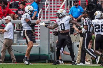 Oct 3, 2026; Athens, Georgia, USA; Vanderbilt Commodores wide receiver Junior Sherrill (0) reacts with quarterback Blaze Berlowitz (1) after scoring a touchdown against the Georgia Bulldogs at Sanford Stadium. Mandatory Credit: Dale Zanine-Imagn Images