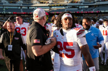 Ohio State Buckeyes running back Bo Jackson (25) gets a high five from offensive coordinator Arthur Smith following the NCAA football game against the Iowa Hawkeyes at Kinnick Stadium in Iowa City on Oct. 3, 2026.