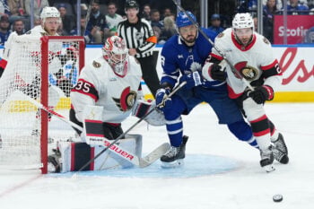 Oct 3, 2026; Toronto, Ontario, CAN;  Toronto Maples Leafs ring wing Kirill Marchenko (86) battles for the puck with Ottawa Senators right wing Michael Amadio (22) during the third period at Scotiabank Arena.  Mandatory Credit: Nick Turchiaro-Imagn Images