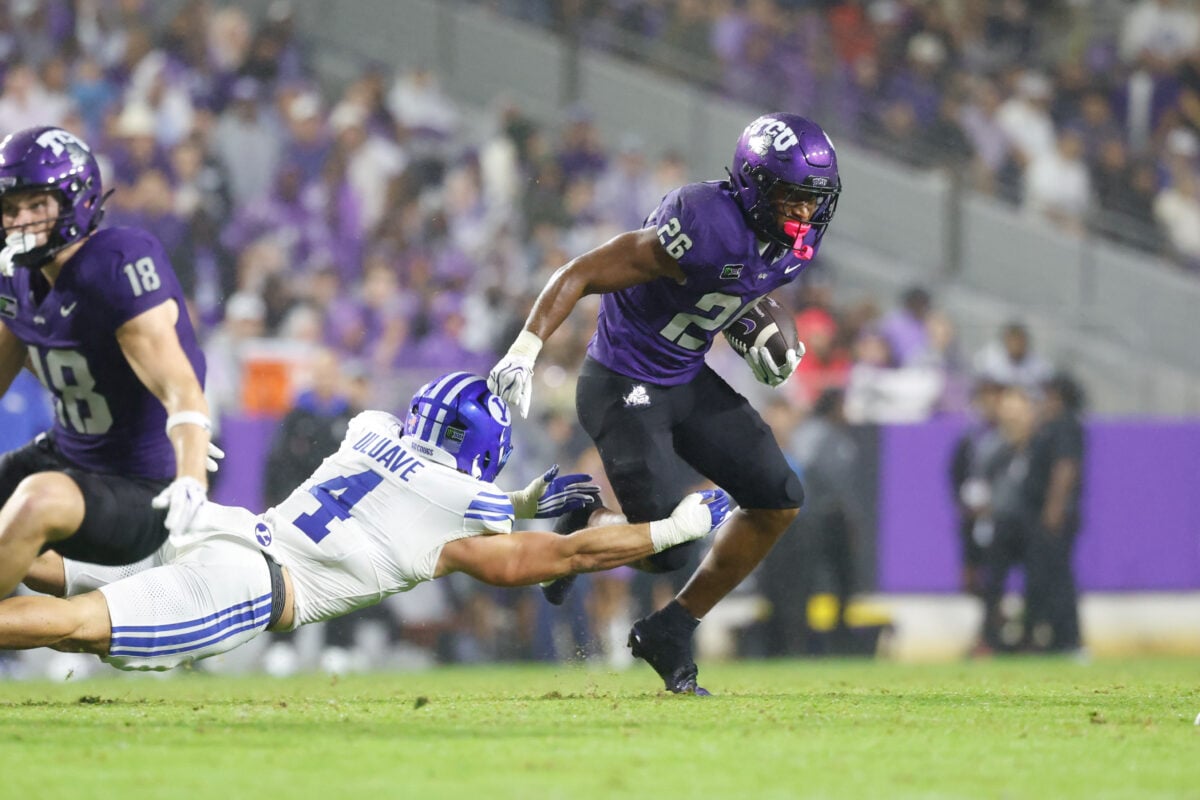 Oct 3, 2026; Fort Worth, Texas, USA; TCU Horned Frogs running back Jeremy Payne (26) runs with the ball against BYU Cougars linebacker Cade Uluave (4) during the second half at Amon G. Carter Stadium. Mandatory Credit: Chris Jones-Imagn Images