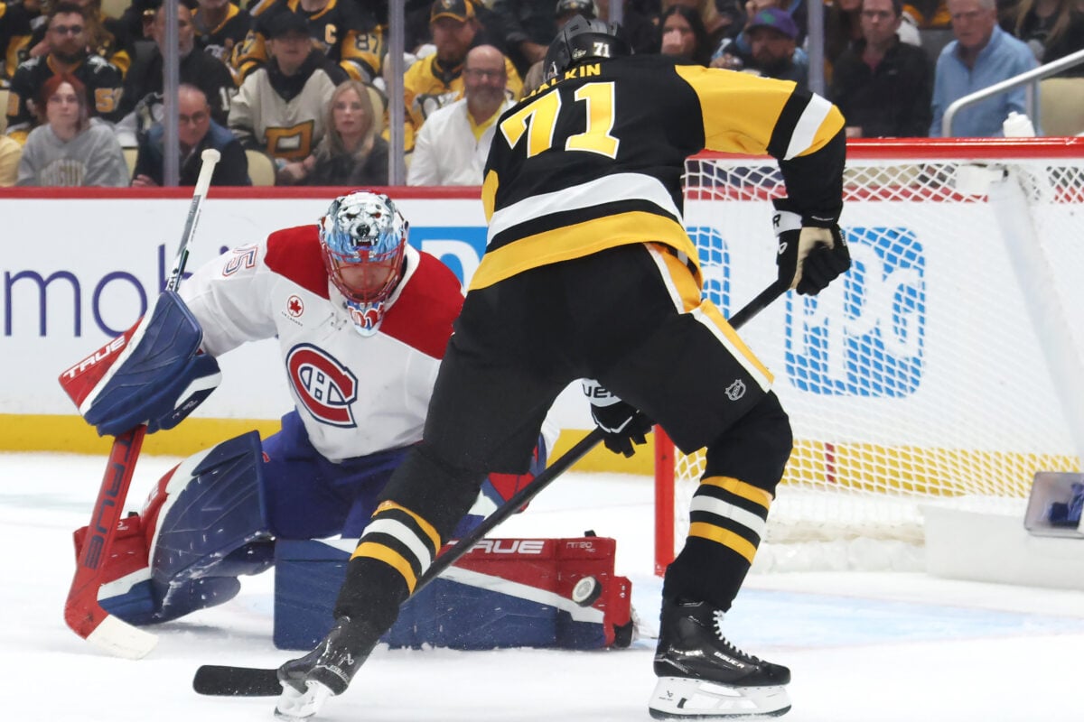 Oct 3, 2026; Pittsburgh, Pennsylvania, USA;  Pittsburgh Penguins center Evgeni Malkin (71) scores a goal against Montreal Canadiens goaltender Jakub Dobes (75) during the first period at PPG Paints Arena.  Mandatory Credit: Charles LeClaire-Imagn Images