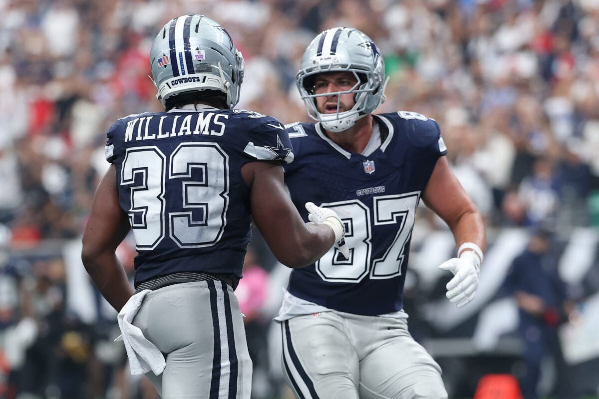 Oct 4, 2026; Houston, Texas, USA;  Dallas Cowboys running back Javonte Williams (33) reacts with tight end Jake Ferguson (87) after scoring a touchdown against the Houston Texans during the second half at Reliant Stadium.  Mandatory Credit: Troy Taormina-Imagn Images