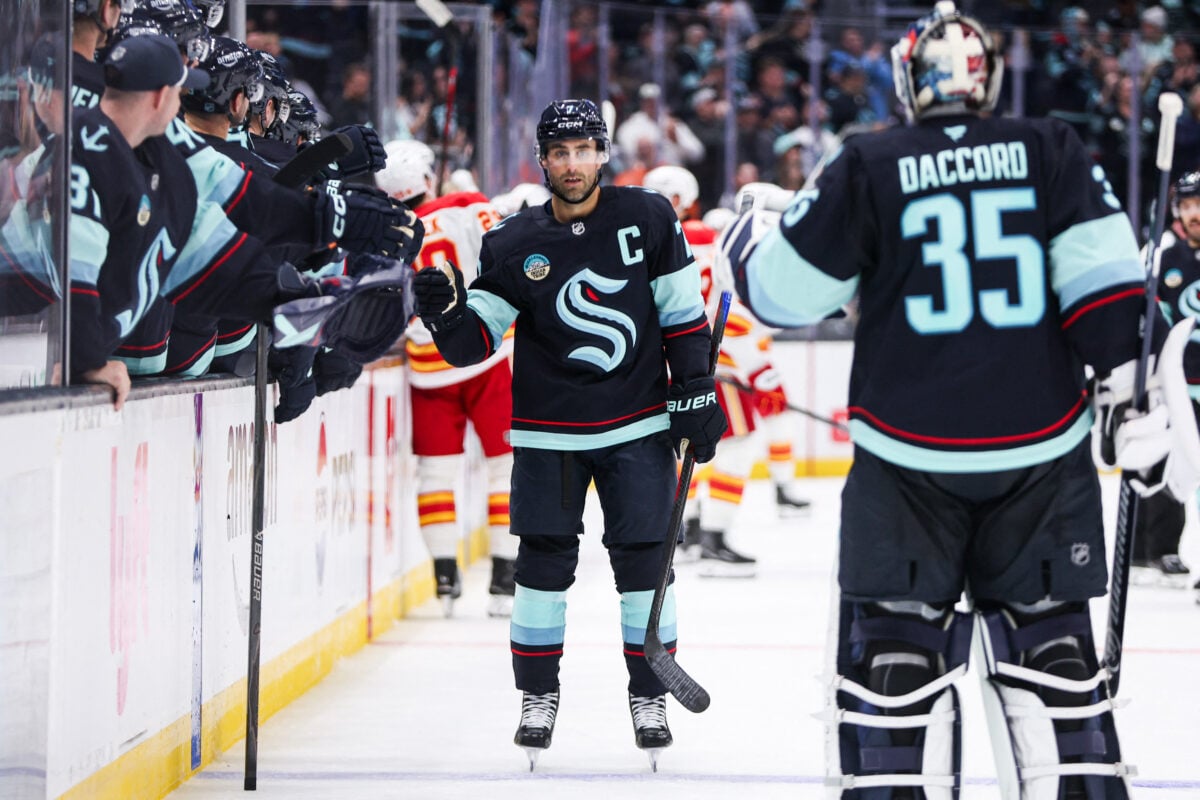 Oct 4, 2026; Seattle, Washington, USA; Seattle Kraken right wing Jordan Eberle (7) celebrates with the bench after scoring a goal in the third period against the Calgary Flames at Climate Pledge Arena. Mandatory Credit: Kevin Ng-Imagn Images