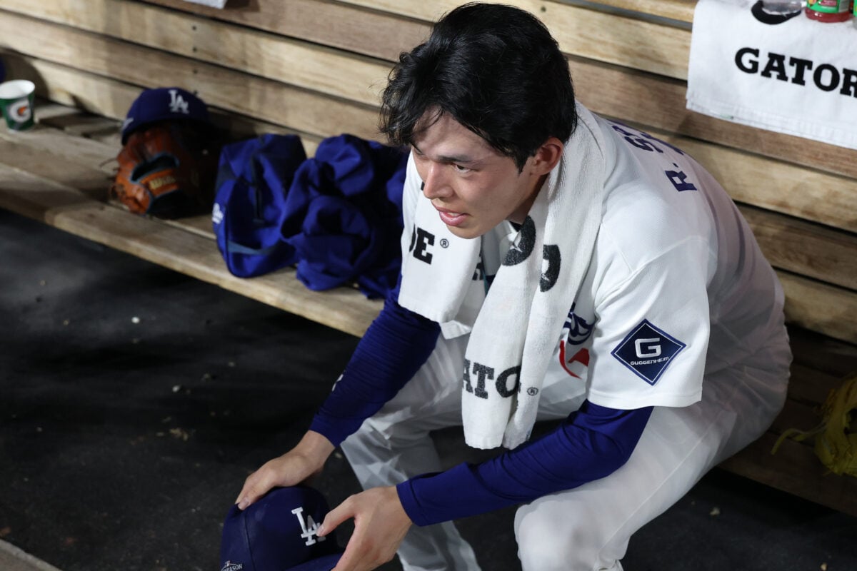 Oct 4, 2026; Los Angeles, California, USA;  Los Angeles Dodgers pitcher Roki Sasaki (11) in the dugout during the ninth inning against the Atlanta Braves in game two of the NLDS for the 2026 MLB Playoffs at Uniqlo Field at Dodger Stadium.  Mandatory Credit: Kiyoshi Mio-Imagn Images