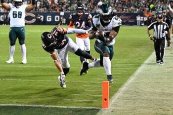 Sep 28, 2026; Chicago, Illinois, USA;  Philadelphia Eagles running back Saquon Barkley (26) runs against Chicago Bears safety Dillon Thieneman (31) during the first half at Soldier Field. Mandatory Credit: Matt Marton-Imagn Images