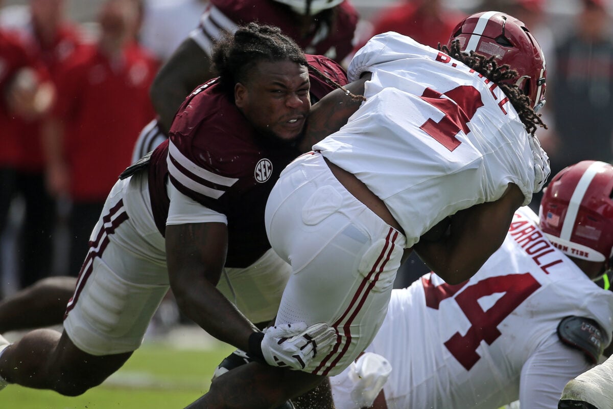 Oct 3, 2026; Starkville, Mississippi, USA; Mississippi State Bulldogs defensive lineman Jaray Bledsoe (9) tackles Alabama Crimson Tide running back Daniel Hill (4) during the second quarter at Davis Wade Stadium at Scott Field. Mandatory Credit: Petre Thomas-Imagn Images