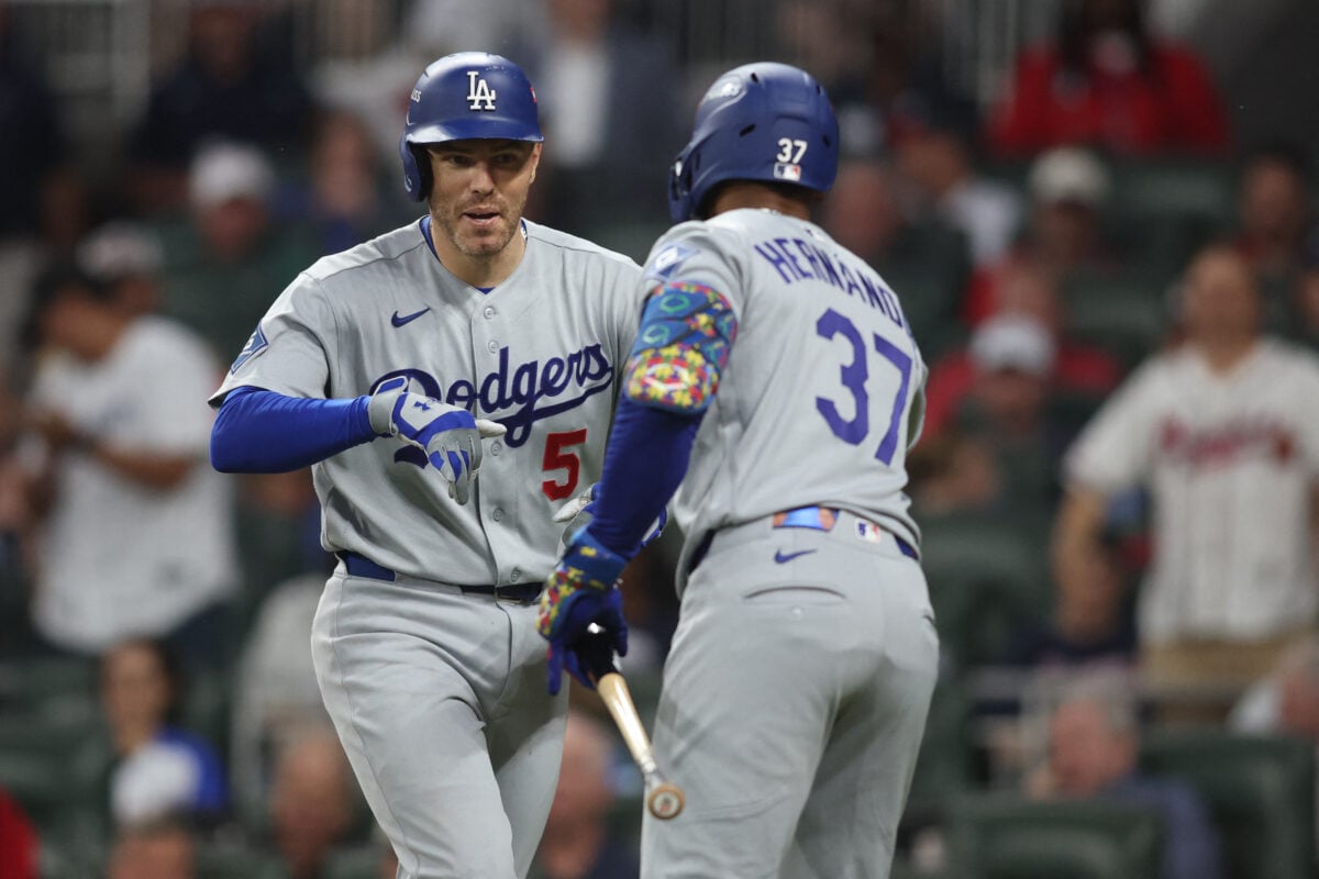 Oct 6, 2026; Cumberland, Georgia, USA;  Los Angeles Dodgers first baseman Freddie Freeman (5) is greeted by. outfielder Teoscar Hernandez (37) after hitting a solo home run during the fourth inning against the Atlanta Braves at Truist Park.  Mandatory Credit: Brett Davis-Imagn Images
