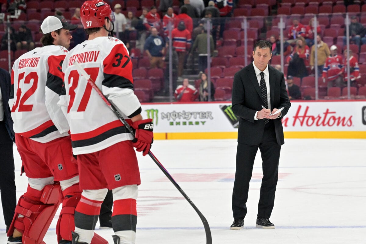 Oct 6, 2026; Montreal, Quebec, CAN;  Carolina Hurricanes head coach Rod Brind'Amour waits for goalie Brandon Bussi (32) and forward Andrei Svechnikov (37) after the win against the Montreal Canadiens at the Bell Centre.  Mandatory Credit: Eric Bolte-Imagn Images