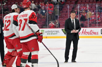 Oct 6, 2026; Montreal, Quebec, CAN;  Carolina Hurricanes head coach Rod Brind'Amour waits for goalie Brandon Bussi (32) and forward Andrei Svechnikov (37) after the win against the Montreal Canadiens at the Bell Centre.  Mandatory Credit: Eric Bolte-Imagn Images